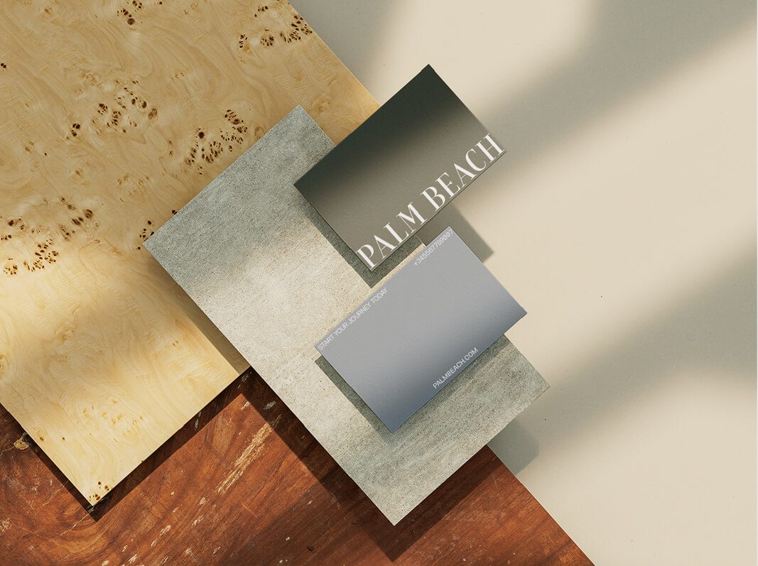 Palm Beach branding: gray and olive green business cards on wood and stone textures.