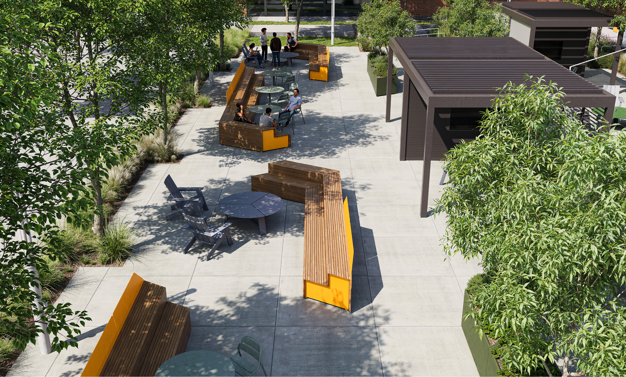 Outdoor courtyard with modern benches, tables, and landscaping. People are relaxing in the space.