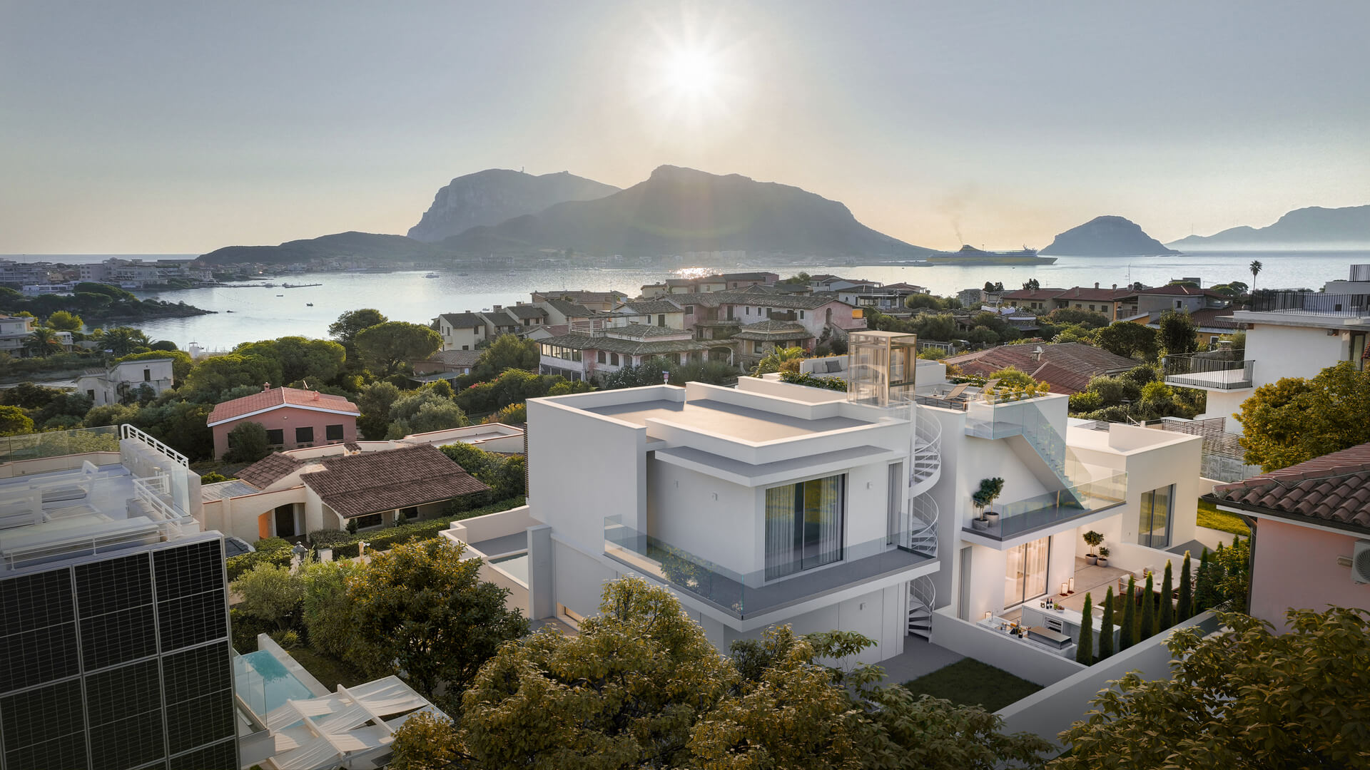 Modern white villa with a spiral staircase overlooking the sea and mountains.