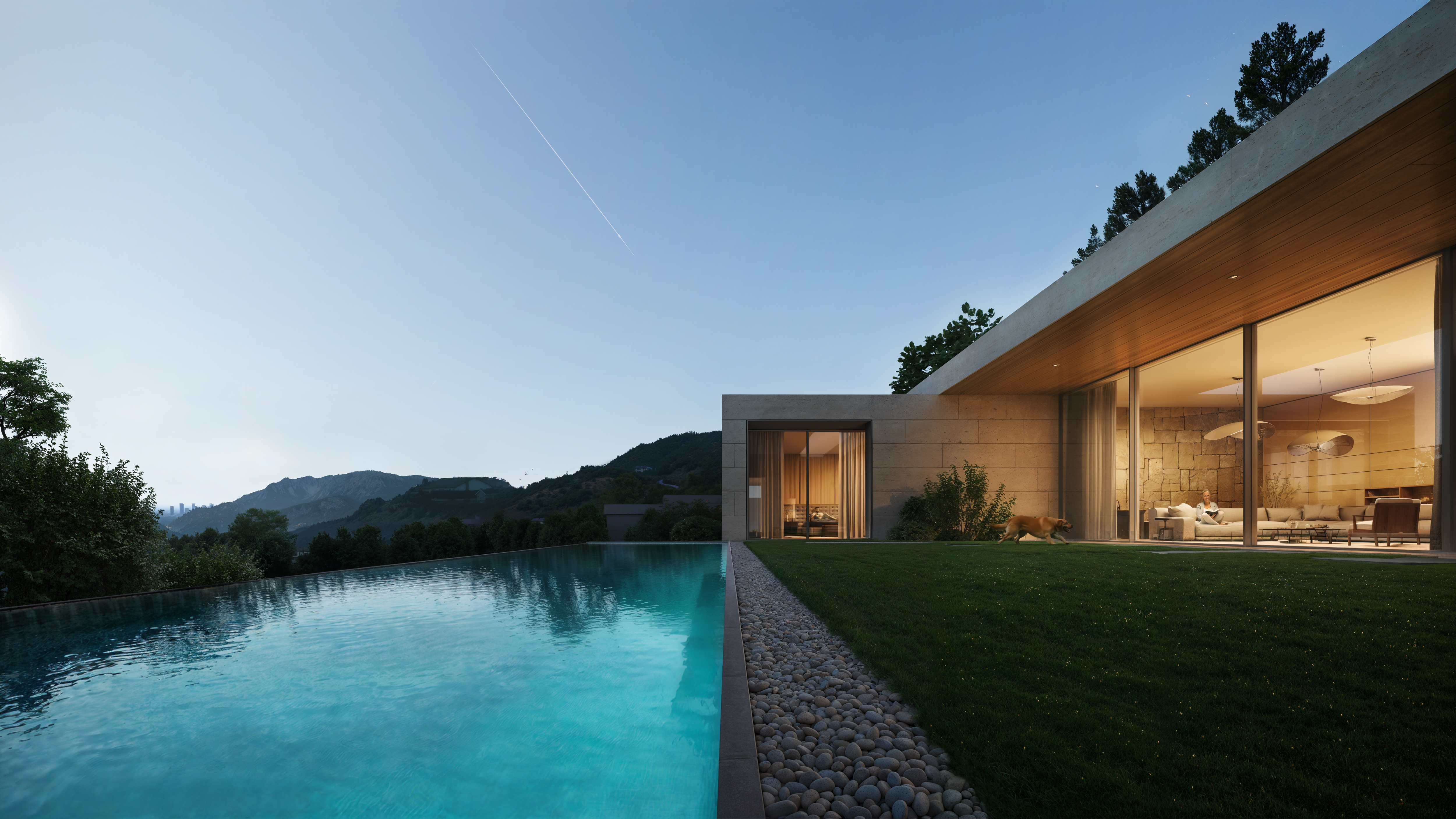 Modern luxury villa with infinity pool overlooking mountains at dusk.